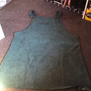 A green dress/overalls